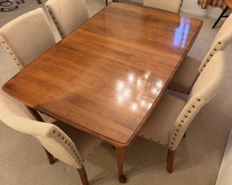 Dining table with upholstered nailhead chairs. Room for the whole family and then some.