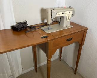 Singer cabinet opened up with the foot control. Your craft room just got an upgrade.