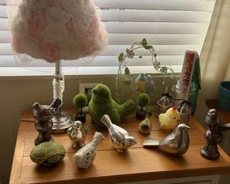 Bird figurines galore, a ruffled rose lamp and garden decor. Tweet tweet.