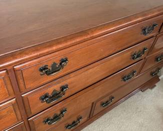Dresser drawers and brass hardware up close.
