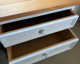 Nightstand drawers open for a peek inside.