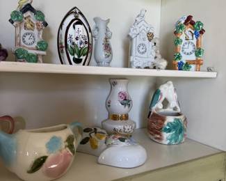 Cuckoo clock style figurines, hand painted vases and floral pottery. Cuteness overload.