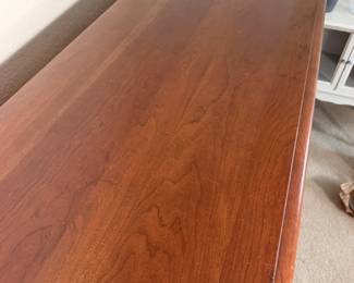 Smooth dresser top with gorgeous wood grain.