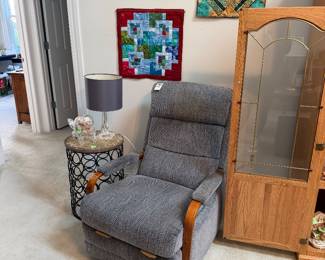 Rocker, quilted wall hangings, glass fish
