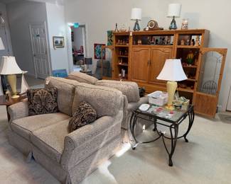 3 pc. oak entertainment cabinet, hand carved figures by the late Ed Kmoch, Clayton Marcus loveseats, lamps