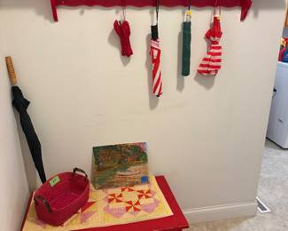 Red shelf and bench, vases