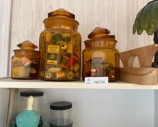 Lot 7312941: Set of 3 Amber Glass Canister Jars w/ Vintage Thread Spools