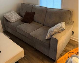 Lot 7312591: Contemporary Gray Textured Upholstered Three-Seat Sofa with Decorative Accent Pillows