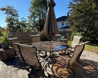 PRESALE ITEM. Patio set-round smoke-top glass table w/6 chairs and umbrella. $150
