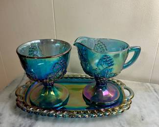 Blue carnival glass cream and sugar set with matching handled tray