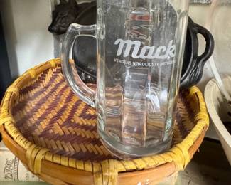 Cast iron cow, wicker, MACK beer mug,