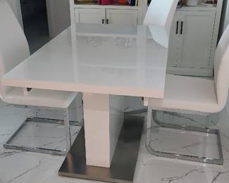 Modern table with stowaway leaf measures 47 x 31 x 18