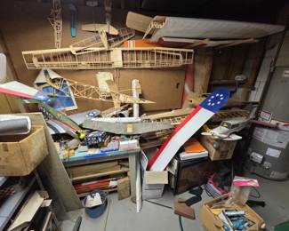 Room filled with airplane model parts