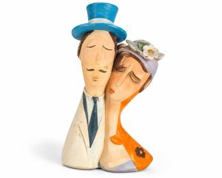Casal cubista com chapeus coloridos
