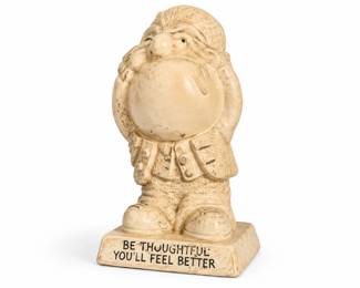 Estatueta de coruja com mensagem inspiradora