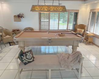 Perfect condition. This Schmidt pool table dates back to the early 90s and the felt is a mauvish-pink. The table features leather basket pockets.