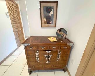 She has papers! This adorable Japanese dresser has metal accents and the wood grain is just fantastic!