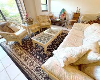 Coastal den bamboo living room set features 7 pieces -- 3 tables, an ottoman, two chairs and a sleeper sofa. It's mellow and comfy!