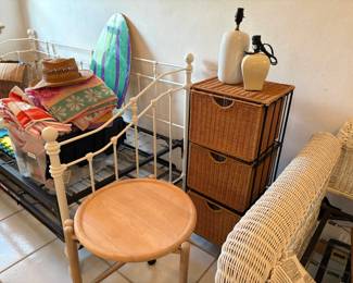 Odds and ends, plus two trundle day beds -- iron to the left, wicker to the right.
