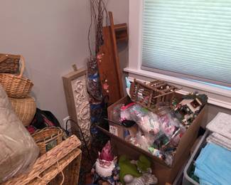 Wicker baskets, garden gnome and crafts with boxed household items