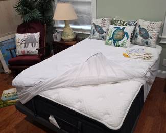 Bedroom with pillow-top mattress, turtle pillows and lamp