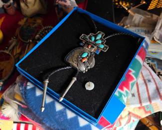 Turquoise-style bolo tie in gift box on Southwestern blanket
