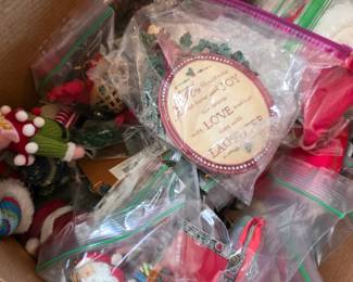 Box of Christmas ornaments and holiday decor in bags