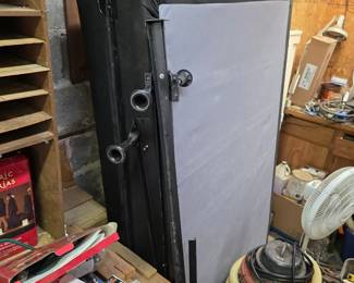Tall rolling tool cabinet with shop vacuum and boxes