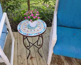 Mosaic-top metal side table with PVC patio chairs