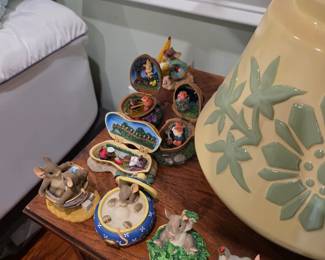 Miniature animal figurines in shell-style houses on nightstand