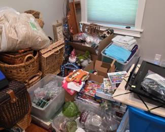 Spare room with baskets, glassware bins and household goods