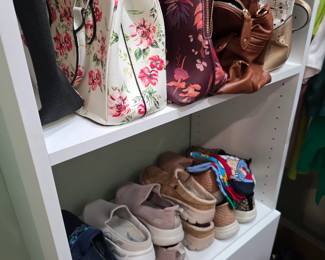 Floral handbags, purses and women's sneakers in closet