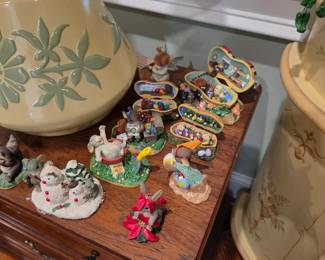 Miniature figurine collection with ceramic lamp on nightstand