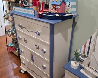 Painted white and blue nautical chest with lighthouse and boat decor