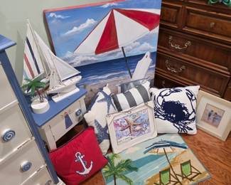 Painted sailboat canvas with anchor and crab pillows, beach rug