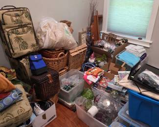 Tapestry-style rolling luggage with baskets, bins and household items