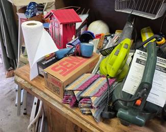 Workbench with electric hedge trimmers, toaster oven and tools