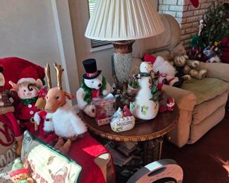 Living room Christmas plush figures with pleated-shade lamp and side table