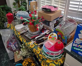 Sunflower tablecloth table with dishes, kitchenware and decor