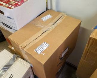 Boxes of jigsaw puzzles with white refrigerator