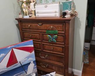 Wood chest of drawers with jewelry box, lamp and beach canvas