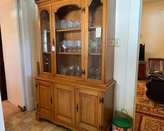 R44 - $175. Maple China Cabinet from Cherokee furniture. Appears to move in one piece. Measures 46" x 17"  x 72.5" tall. Very good vintage condition. 