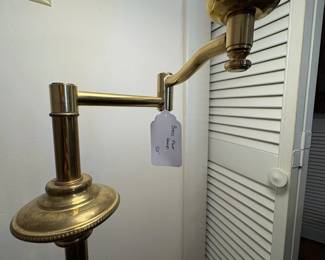 R29 - $50. Brass floor lamp with swinging arm good vintage condition. Works great. 54" tall.