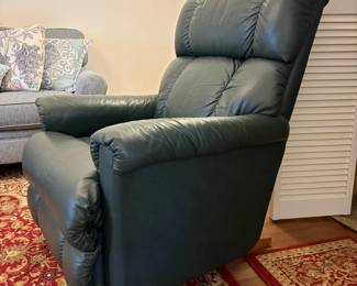  R30 - $100. La-Z-Boy rocker recliner in green leather.  Good condition, no holes or rips noted.  Measures 33" x 36" x 39" tall. 