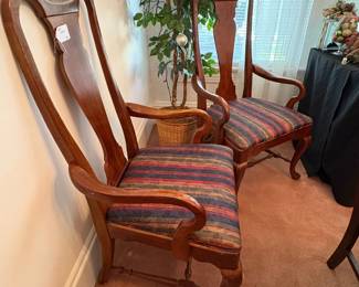 R26 - $40. Pair of arm chairs with upholstered seats. Measures 22" wide x 19" deep x 43" tall. 