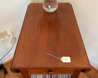 R40 - $45. Single drawer, small wooden drop leaf table. Solid wood. Measures 30.5" x 25" x 26.5" tall. Leaves down it is 14" wide. 