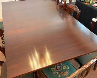 R24 - $250. Georgetown galleries mahogany dropleaf table with eight chair chairs. Fully opened it measures 42" x 74" x 30" tall. With the leaves down it is only 26.5" wide. Very good vintage condition. Has a storage drawer on either side that slide easily.