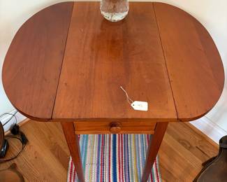 R40 - $45. Single drawer, small wooden drop leaf table. Solid wood. Measures 30.5" x 25" x 26.5" tall. Leaves down it is 14" wide. 