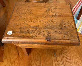 R41 - $20. Small wooden stool with chicken carved in the top. Measures 12" x 10" x 9.5" tall. 