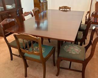 R24 - $250. Georgetown galleries mahogany dropleaf table with eight chair chairs. Fully opened it measures 42" x 74" x 30" tall. With the leaves down it is only 26.5" wide. Very good vintage condition. Has a storage drawer on either side that slide easily.